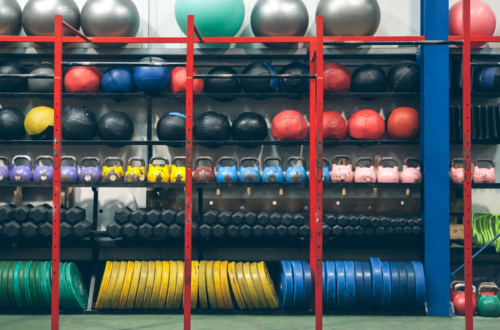 Compact storage unit with training equipment neatly organized on shelves